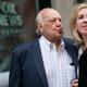 Ailes walks with his wife Elizabeth Tilson as they leave the News Corp building in July. Photo via Getty.